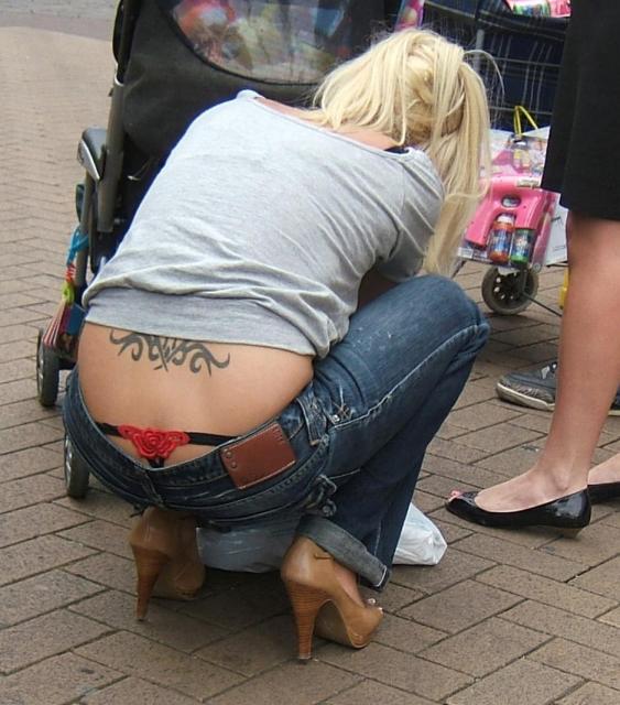 Girl in tight jeans showing thong full size