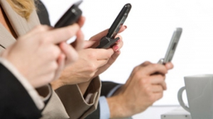 People on cell phones during meetings 950X534 jpeg