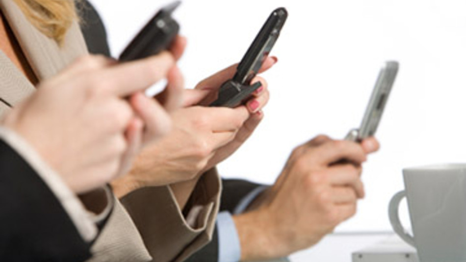 People on cell phones during meetings full size