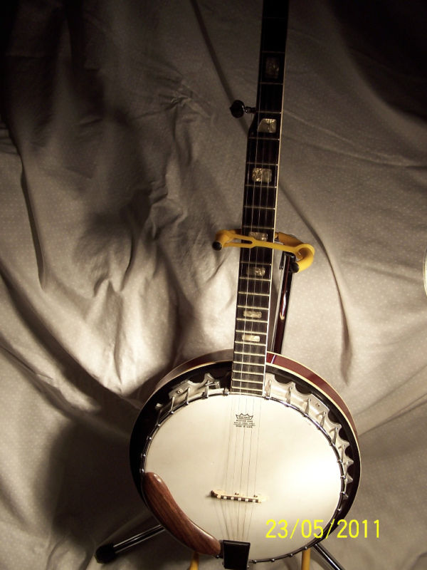 Vintage banjo with eagle on back full size