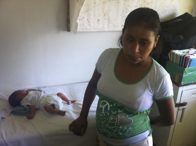Mexican woman gives birth on lawn full size