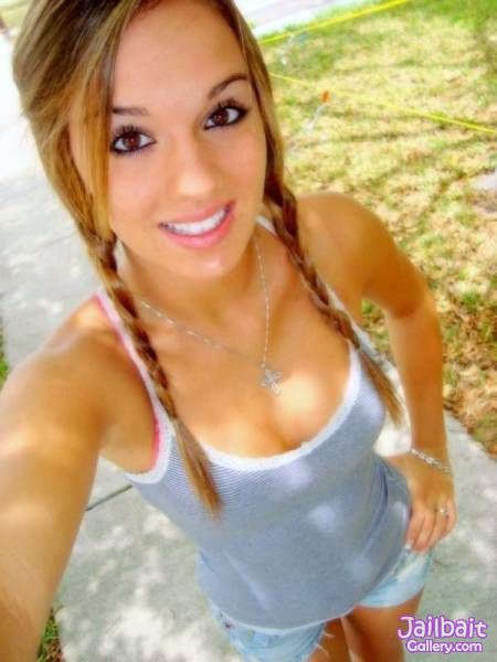 Teen girl with braided pigtails full size