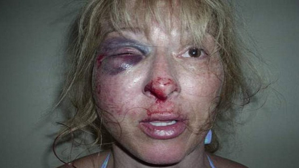 Woman beat up by police officer full size