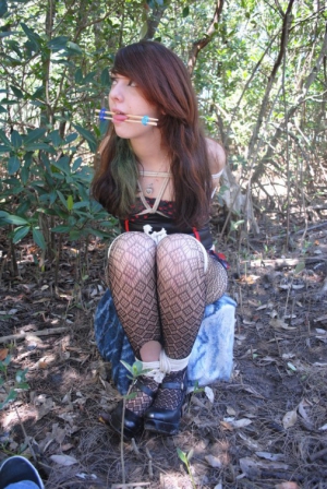 Girl gagged with stick 506X756 jpeg
