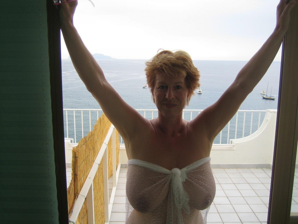 Naughty amateur mature nude woman on vacation full size