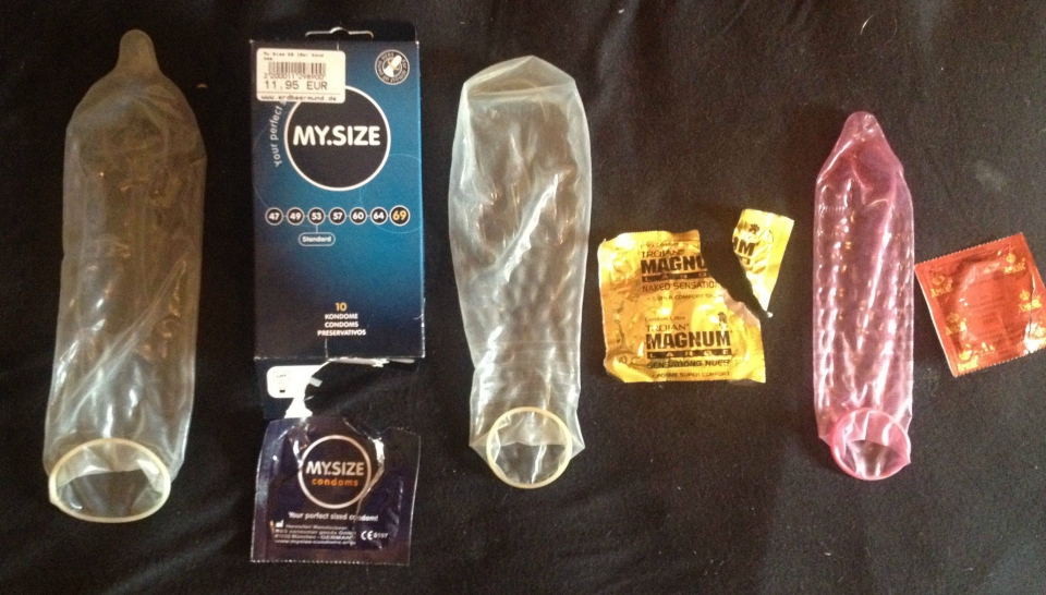 Trojan magnum condom on penis full size