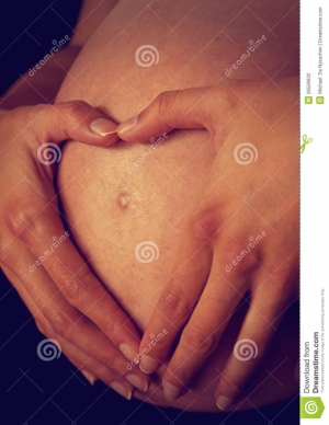 Heart hands on pregnant belly 960X1243 jpeg