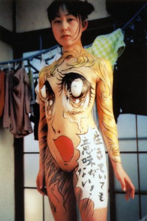 Girl painting body paint 448X672 jpeg
