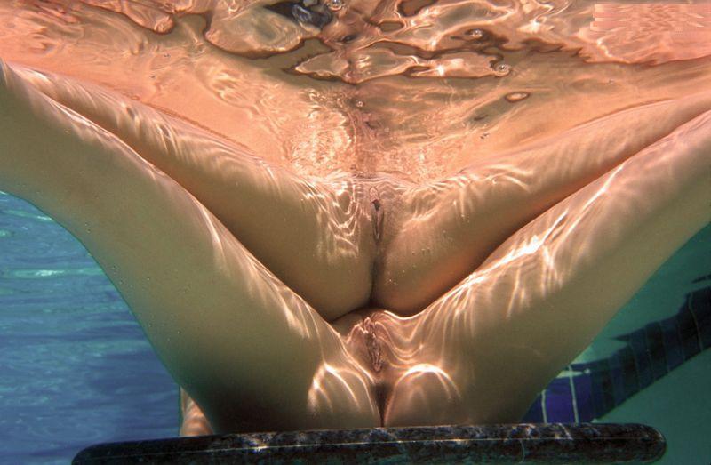 Naked girl underwater swimming pool full size