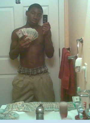 Black gang member with gun 500X685 jpeg