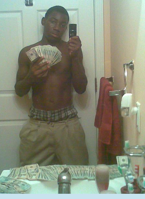 Black gang member with gun full size